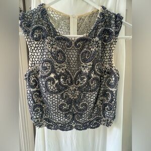 Unique beaded two piece gown.